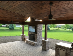 Gable & shed style combination roof with vaulted ceiling and wood burning fireplace