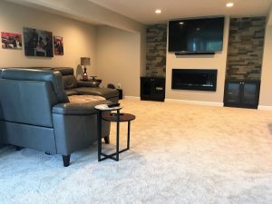 Gas fireplace with inset cabinet and stone veneer