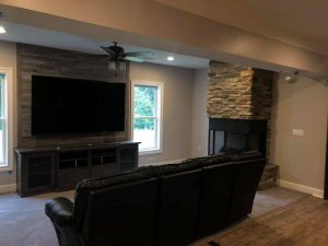 Ship Lap TV wall and stone veneer fireplace