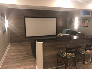 Theater room with ship lap half wall