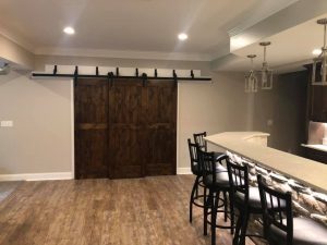 Triple barn door and bar with under-lighting